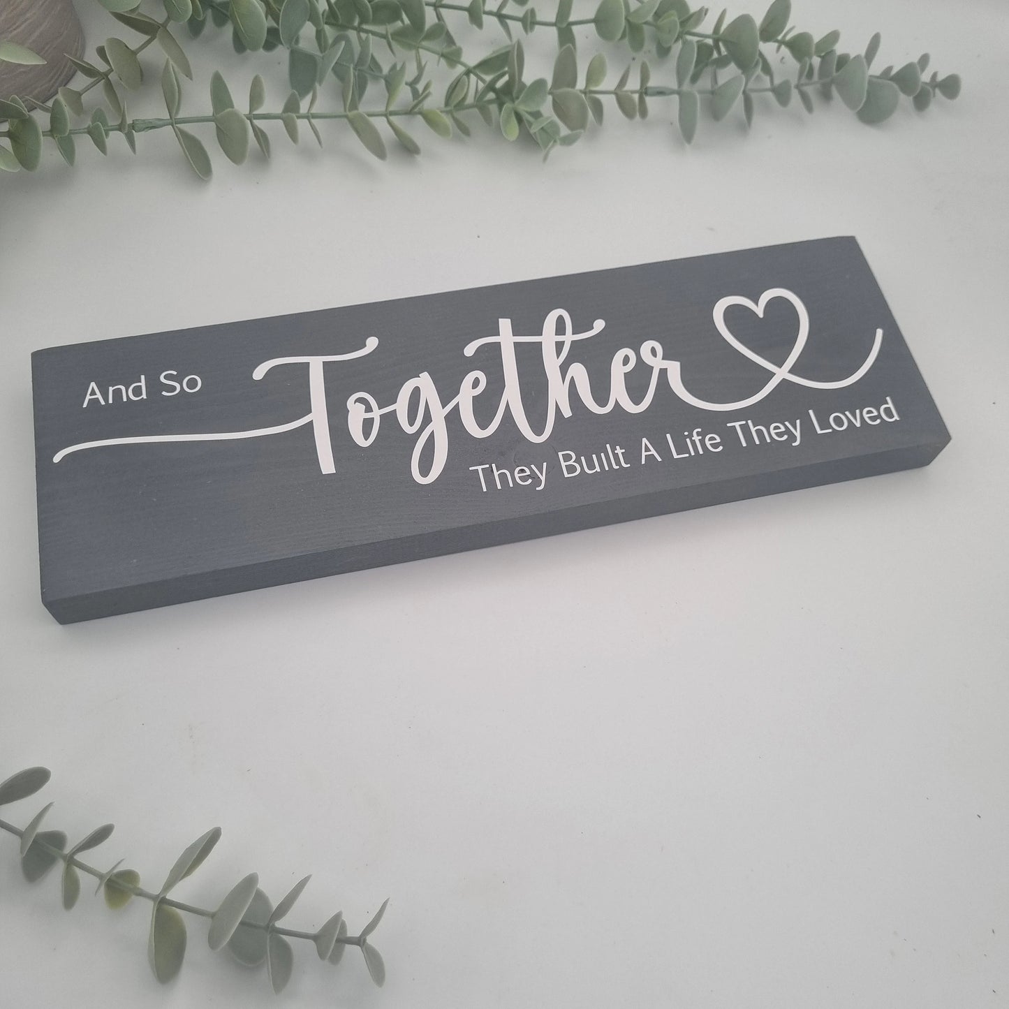 And so together they built a life they loved wooden sign for family home