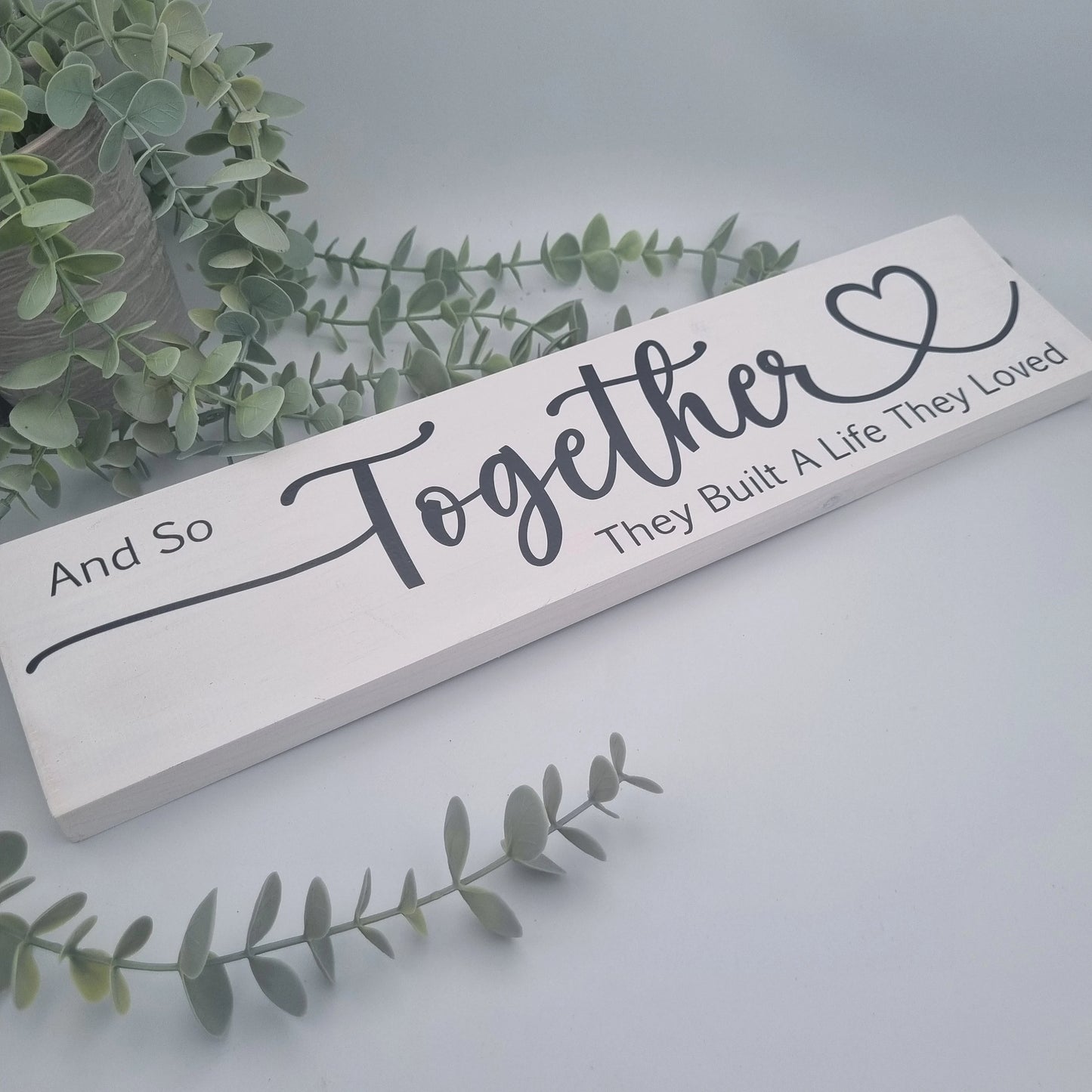 And so together they built a life they loved wooden sign for family home
