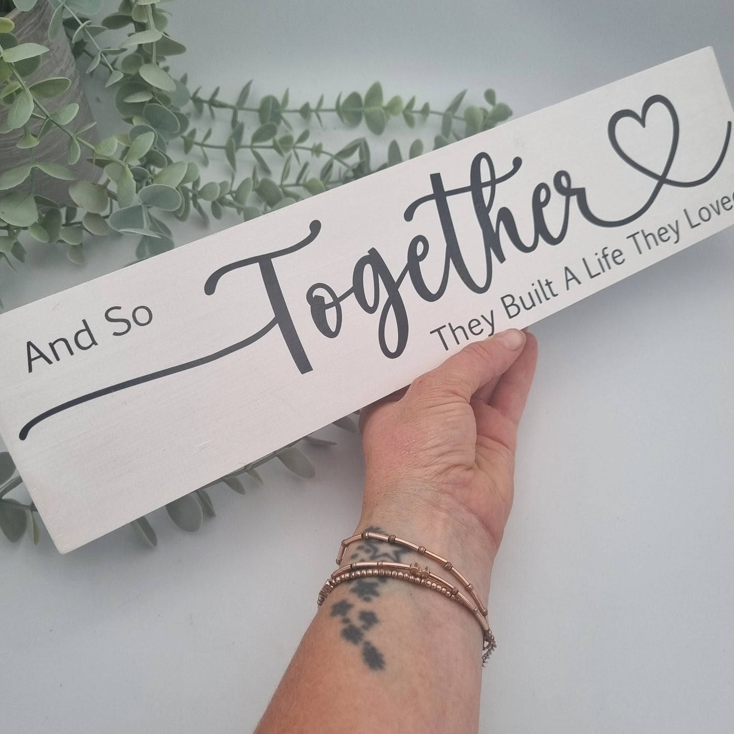 And so together they built a life they loved wooden sign for family home