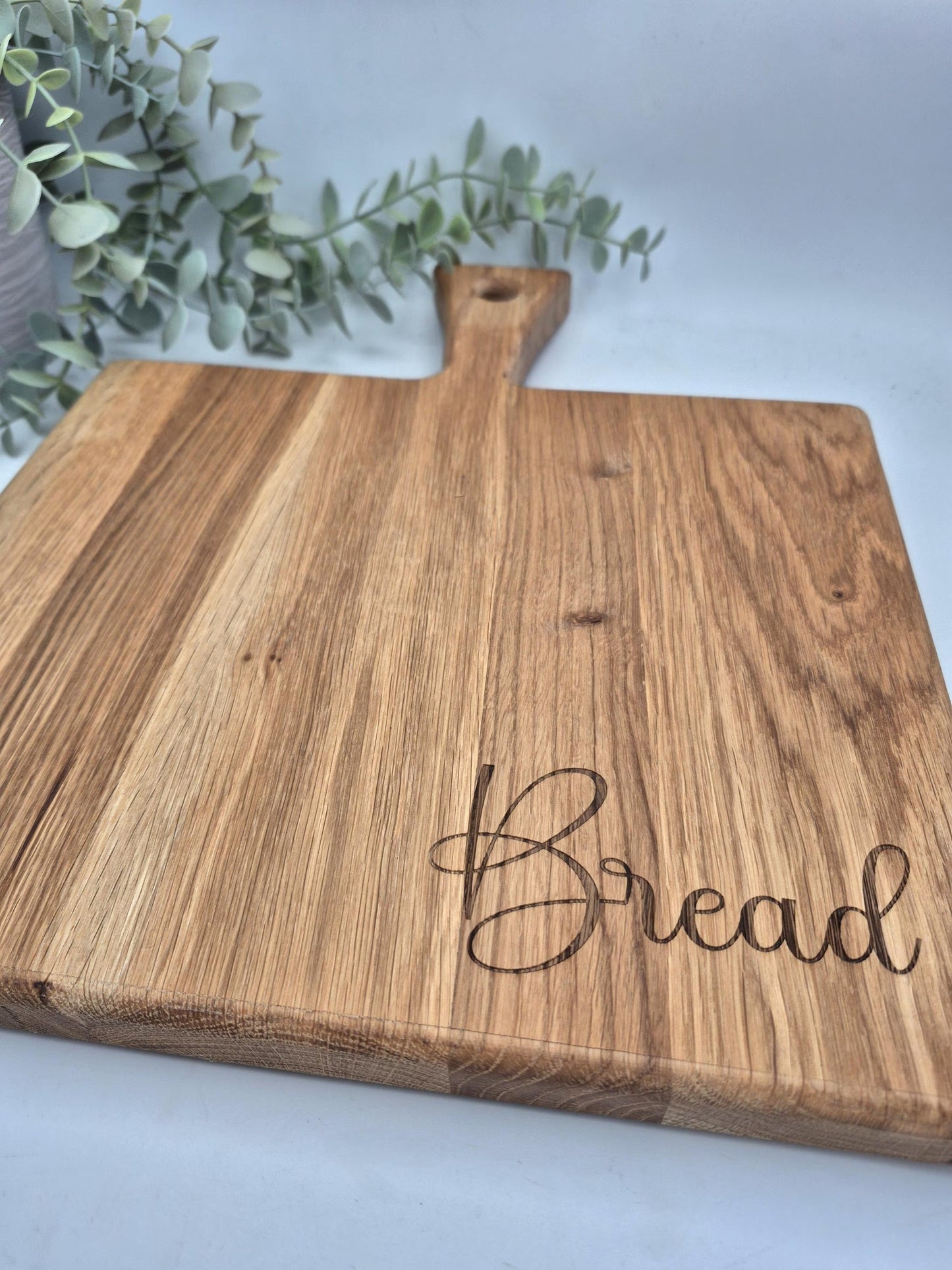 Chunky oak engraved chopping bread board with handle