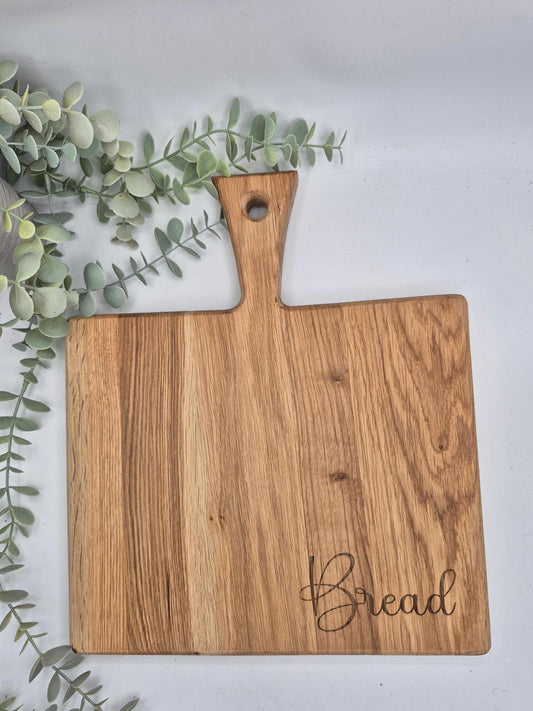 Chunky oak engraved chopping bread board with handle