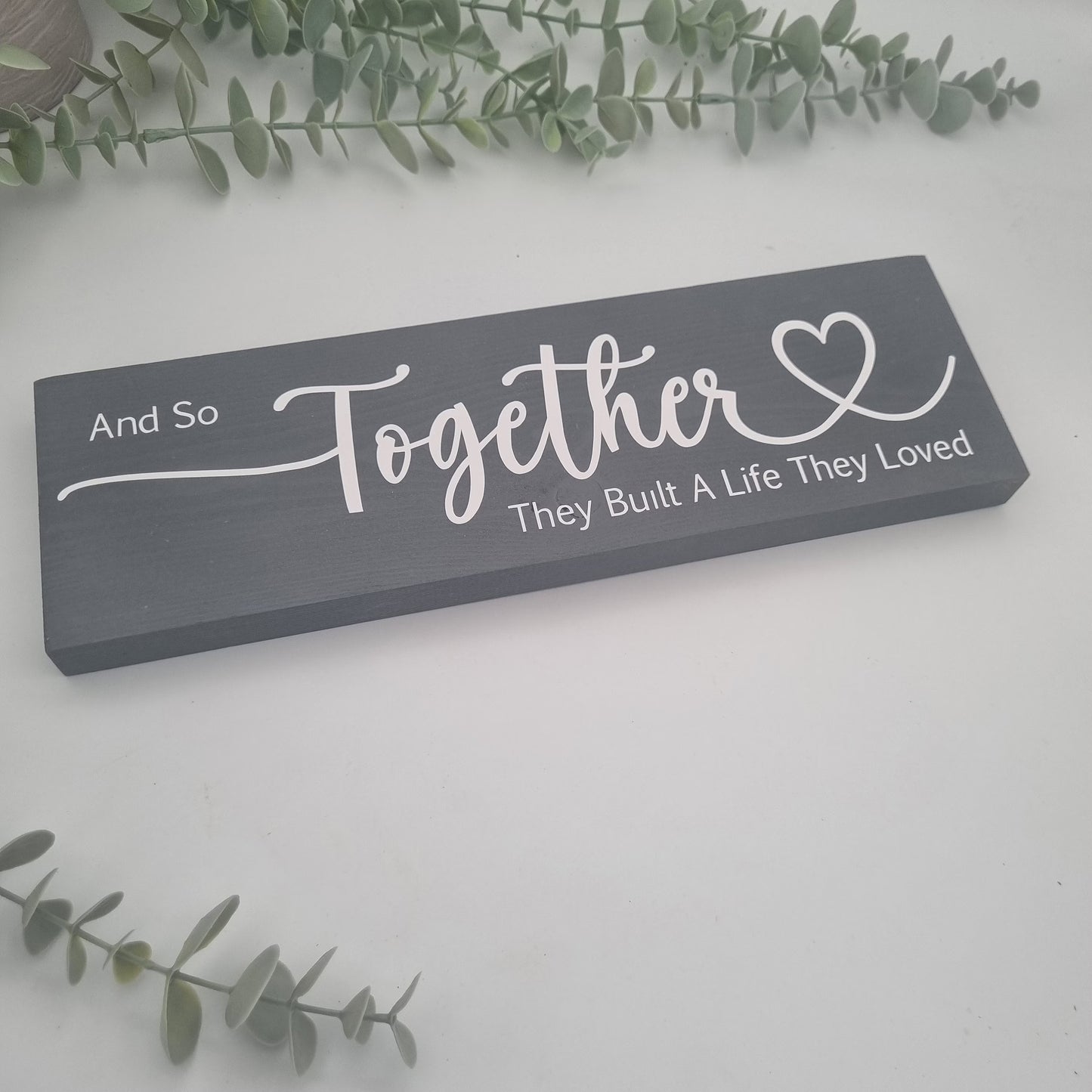 And so together they built a life they loved wooden sign