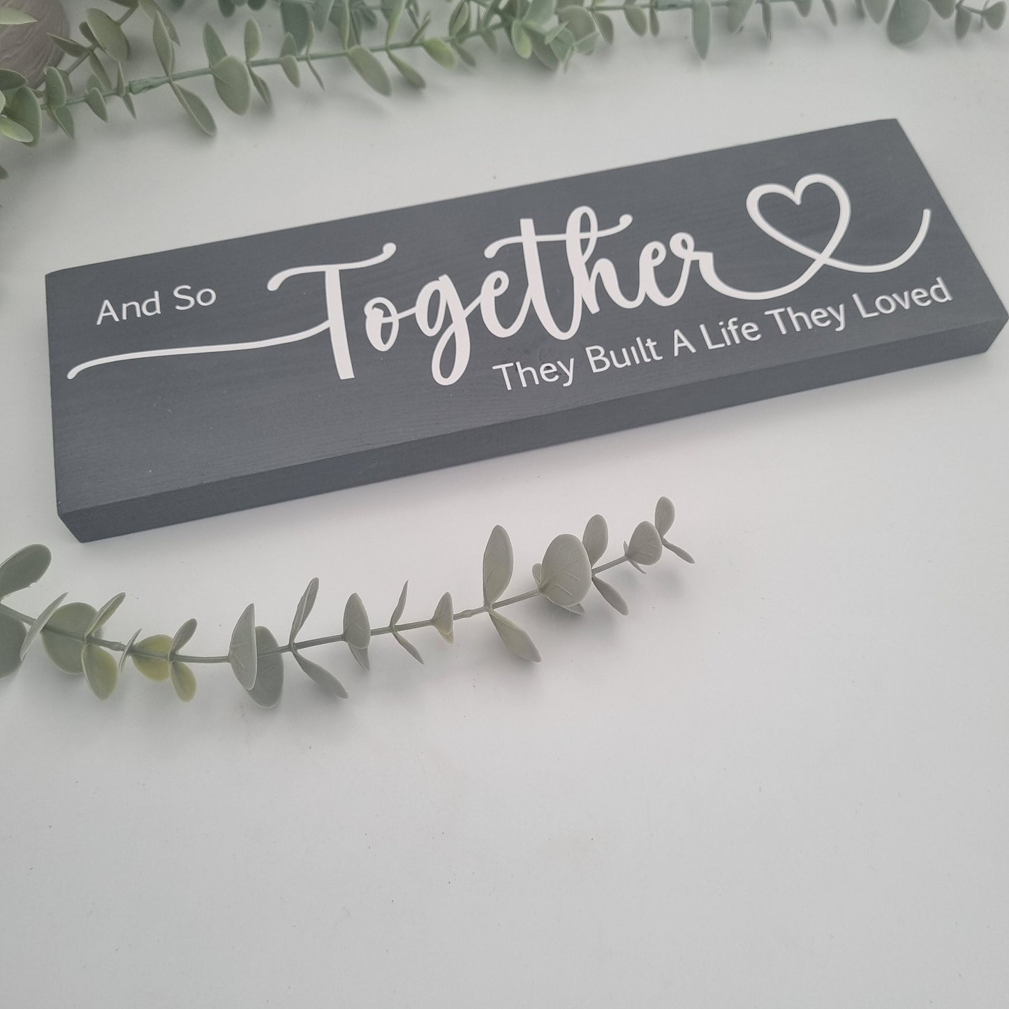 And so together they built a life they loved wooden sign